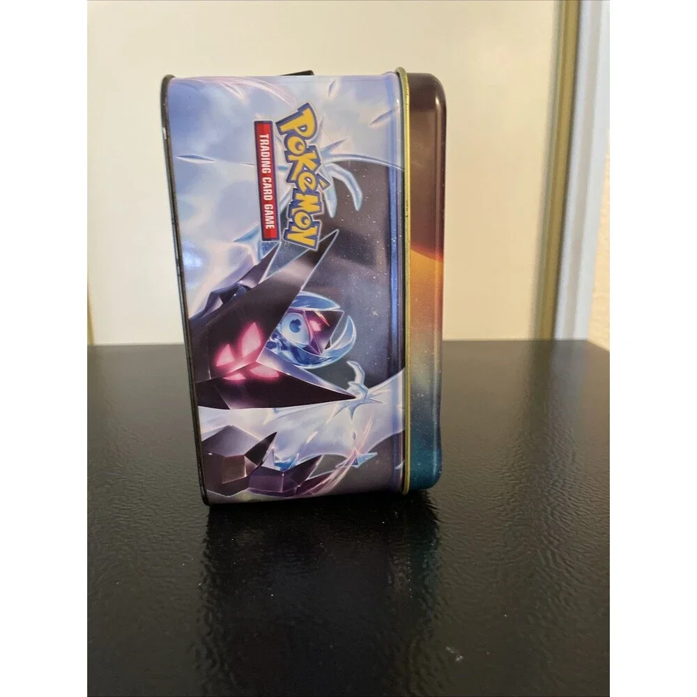 Pokémon Trading Card Tin featuring Dusk Mane Necrozma and Dawn Wings Necrozma